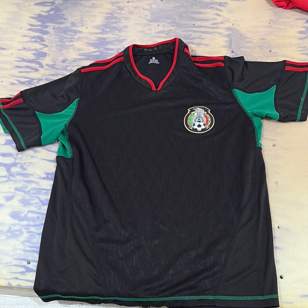 Black and Green Soccer Jersey with Emblem